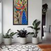 Peacock in the Orchard Madhubani peacock painting by Vidushini Prasad on the Wall